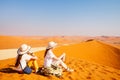 Family on red sand dune Royalty Free Stock Photo