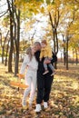 Family: mother, father and baby son playing in autumn park having fun. Family, childhood, season and people Royalty Free Stock Photo
