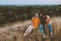 Family mother and father with child on picnic outdoor parents with baby