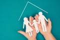 A family, mother, father and child in silhouette, paper cut out, holding in hands Royalty Free Stock Photo