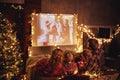 Family mother father and children watching projector, film, movies with popcorn in   christmas evening   at home Royalty Free Stock Photo