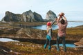 Family mother and father holding up infant baby travel