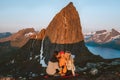 Family mother and father kissing child in mountains traveling together in Norway outdoor camping vacations Royalty Free Stock Photo