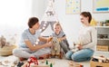 Family mother father and son playing together in children`s pl Royalty Free Stock Photo