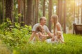 Family - mother, father and two daughters blonde sitting in a su Royalty Free Stock Photo