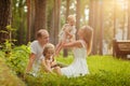 Family - mother, father and two daughters blonde sitting in a su Royalty Free Stock Photo