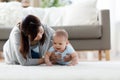 Mother with crying little baby boy at home Royalty Free Stock Photo