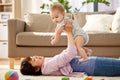 Happy mother playing with little baby son at home Royalty Free Stock Photo