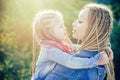 Family and motherhood concept. Mother and child girl playing kissing and hugging. Little daughter hugging her happy Royalty Free Stock Photo