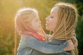 Family and motherhood concept. Mother and child girl playing kissing and hugging. Little daughter hugging her happy Royalty Free Stock Photo