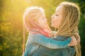 Family and motherhood concept. Mother and child girl playing kissing and hugging. Little daughter hugging her happy Royalty Free Stock Photo