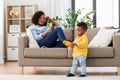 Baby playing toy car and mother with smartphone Royalty Free Stock Photo