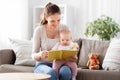 happy mother reading book to little baby at home Royalty Free Stock Photo