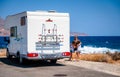 Family with a motorhome RV parked by the sea in Kissamos, Crete, Greece Royalty Free Stock Photo