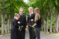 Family mourning on funeral at cemetery Royalty Free Stock Photo
