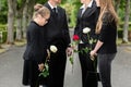 Family mourning on funeral at cemetery Royalty Free Stock Photo