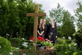 Family mourning at grave on cemetery Royalty Free Stock Photo