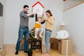 Family moved into a new apartment, parents playing with their son Royalty Free Stock Photo