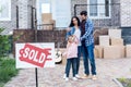 family moving into new house with sold signboard Royalty Free Stock Photo