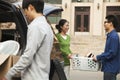 Family moving their son into dormitory on college campus