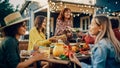 Family and Multiethnic Diverse Friends Gathering Together at a Garden Table. People Eating Grilled Royalty Free Stock Photo