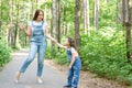 Family and nature concept - Attractive young woman have fun with her little daughter in the park Royalty Free Stock Photo