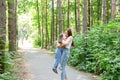 Family and nature concept - Young woman hug little girl in the park Royalty Free Stock Photo