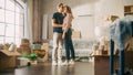 Family New Home Moving in: Happy and Excited Young Couple Enter Newly Purchased Apartment. Beautiful Royalty Free Stock Photo