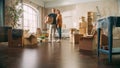 Family New Home Moving in: Happy and Excited Young Couple Enter Newly Purchased Apartment. Beautiful Royalty Free Stock Photo