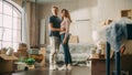 Family New Home Moving in: Happy and Excited Young Couple Enter Newly Purchased Apartment. Beautiful Royalty Free Stock Photo