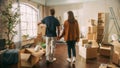 Family New Home Moving in: Happy and Excited Young Couple Enter Newly Purchased Apartment. Beautiful Royalty Free Stock Photo