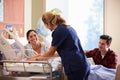 Family And Nurse With New Born Baby In Post Natal Department Royalty Free Stock Photo