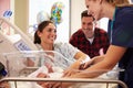 Family And Nurse With New Born Baby In Post Natal Department Royalty Free Stock Photo