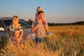 Family with offroad car on wheaten field Royalty Free Stock Photo