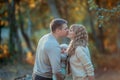 Family outdoors feel the love of their child hugging and kissing him in the autumn forest on a walk Royalty Free Stock Photo