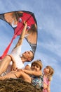 The family outdoors flying kite in the sky Royalty Free Stock Photo