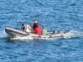 Family outing in an inflatable boat in front of Pendennis Castle near Falmouth