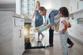 Family, oven and father cooking with girl and mother in kitchen preparing delicious meal. Food, learning or interracial Royalty Free Stock Photo