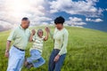 Family Over Clouds, Sky and Grass Field Royalty Free Stock Photo