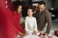 Family packing Christmas presents Royalty Free Stock Photo