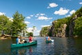 Family Paddling on Canoes on the Lake