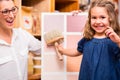 Family with paint sample card in store Royalty Free Stock Photo