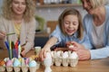 Happy family painting Easter eggs at home together Royalty Free Stock Photo