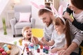 Family painting Easter eggs together at table Royalty Free Stock Photo