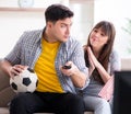 Family pair watching football at home Royalty Free Stock Photo