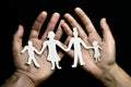 Family papercut in hands
