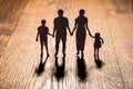 Family Papercut On Wooden Desk