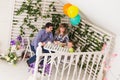 Family, parenthood, happy birthday and holiday concept - happy parents and child at a table drinking tea and eating cake Royalty Free Stock Photo