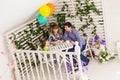 Family, parenthood, happy birthday and holiday concept - happy parents and child at a table drinking tea and eating cake Royalty Free Stock Photo