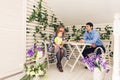 Family, parenthood, happy birthday and holiday concept - happy parents and child at a table drinking tea and eating cake Royalty Free Stock Photo